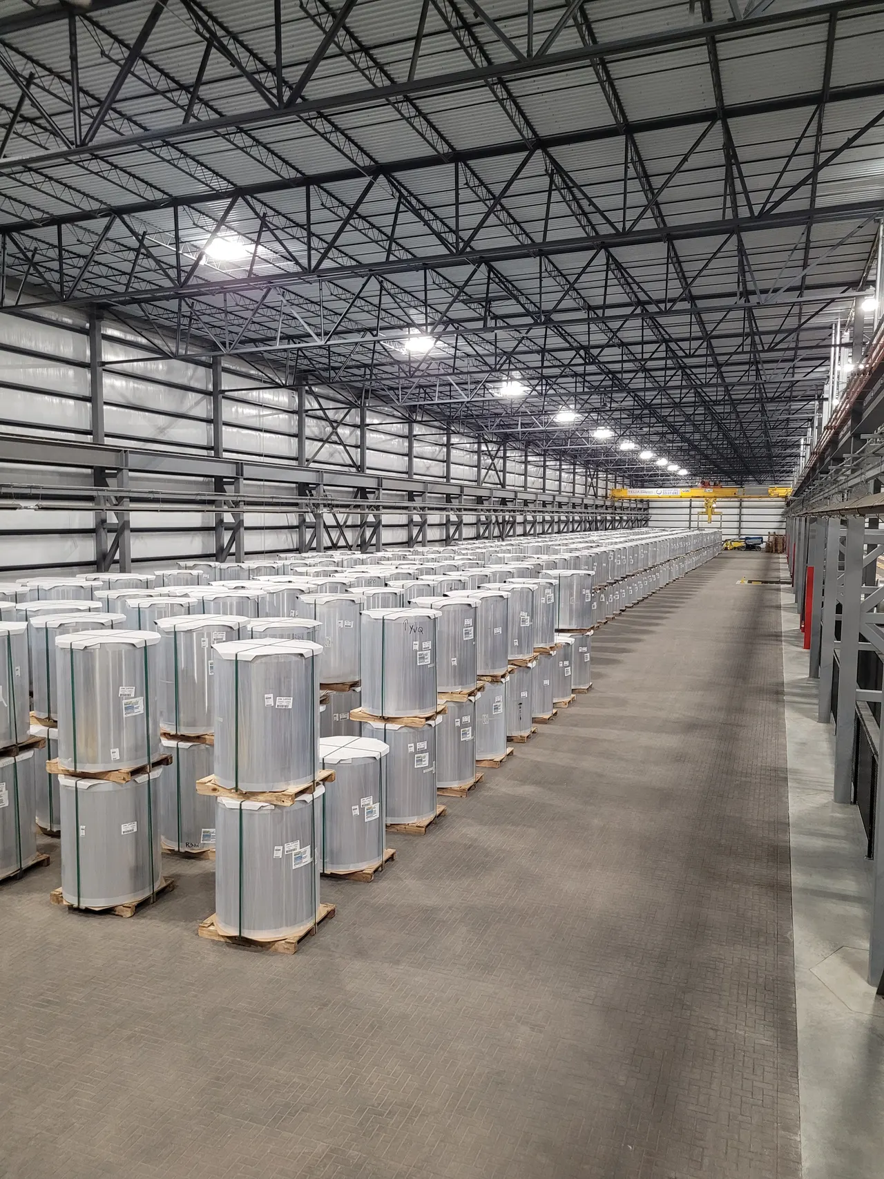 Steel product stored on pallets inside a distribution warehouse