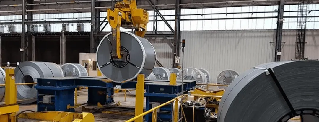 Coils handled individually on the floor, leaving vertical space unused