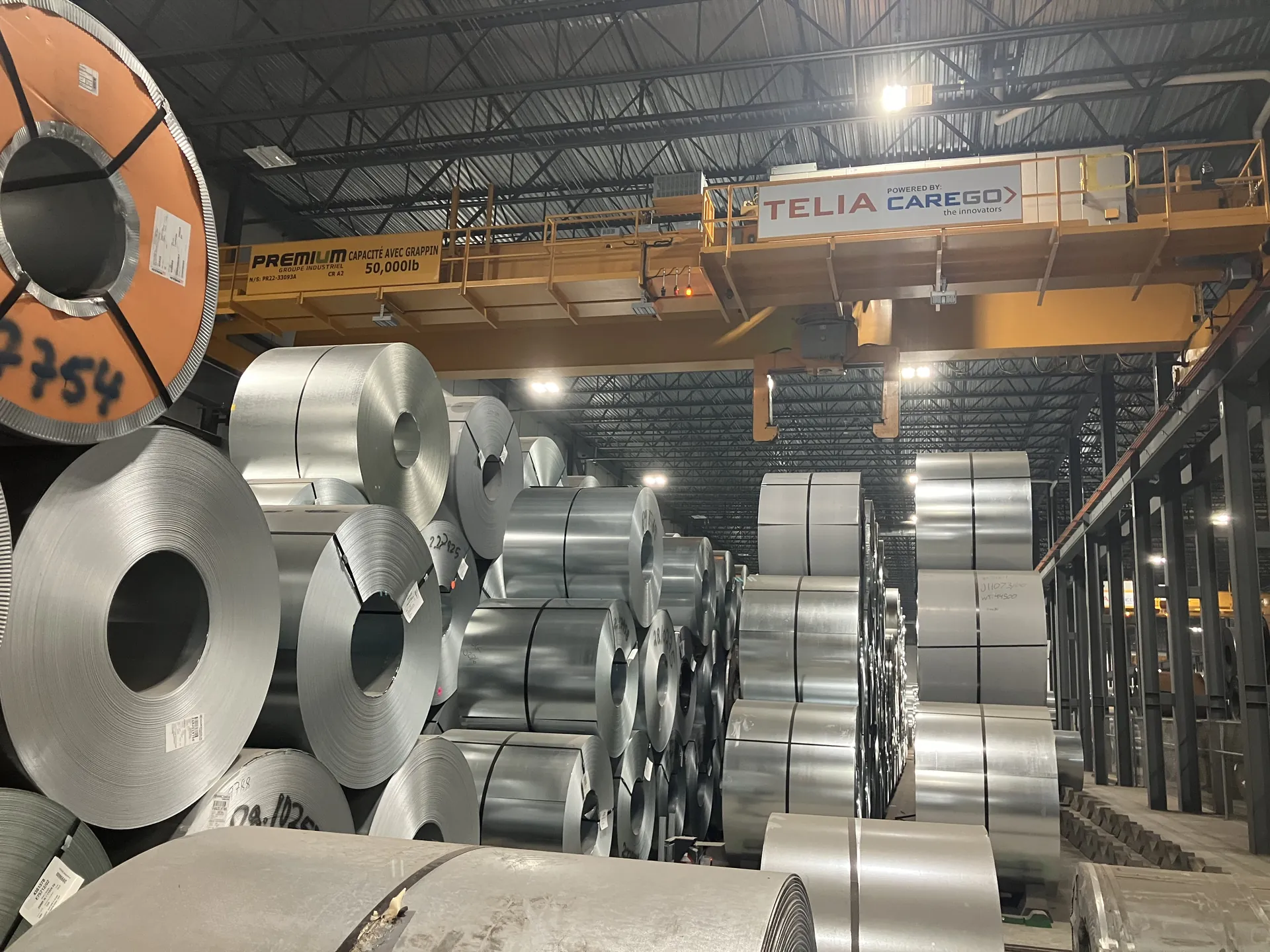 CareGo overhead crane serving a dense coil storage facility